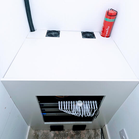 Finished build with wood framing, cable loom, and automatic fire extinguisher.